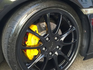 Speed Yellow brake callipers with uprated pads on Porsche 911 996.